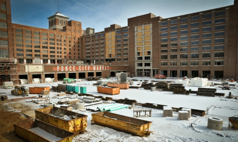 This construction shot shows the secondary building identification, recently hand painted on the red brick facade. 