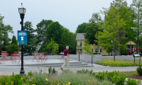 Proposed signage at Westwood’s Town Hall Park provides more information about the DORA via a QR code.